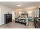 Comfortable bedroom with neutral walls, carpet floors, and furniture at 6400 Woodland Ln, McCordsville, IN 46055