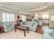 Open-concept living area featuring hardwood floors, stylish furniture, and lots of natural light at 6400 Woodland Ln, McCordsville, IN 46055