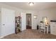 A functional office space with a desk, bookshelves, and ample storage is connected to the bedroom at 6400 Woodland Ln, McCordsville, IN 46055