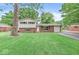 Charming two-story home with brick accents and a well-manicured front lawn at 6616 W 15Th St, Indianapolis, IN 46214