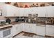 Cozy kitchen featuring white cabinetry, modern appliances, and warm, inviting decor at 6616 W 15Th St, Indianapolis, IN 46214