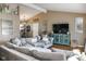 Cozy living room with vaulted ceilings, a large sectional sofa, and stylish décor creates a warm, inviting space at 6616 W 15Th St, Indianapolis, IN 46214