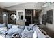 Comfortable living room featuring plush, oversized seating, stylish decor and staircase access at 6616 W 15Th St, Indianapolis, IN 46214