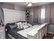 Bedroom featuring a cozy bed with stylish pillows, soft lighting, and a tranquil atmosphere for restful nights at 6616 W 15Th St, Indianapolis, IN 46214