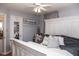 Comfortable bedroom with a statement bed frame, ceiling fan, and soft décor creating a relaxing retreat at 6616 W 15Th St, Indianapolis, IN 46214