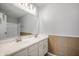 Bathroom with double sink vanity, large mirror, neutral wall colors and tile backsplash at 6677 W Longview Dr, McCordsville, IN 46055