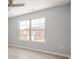 Well-lit bedroom with a large double window, offering ample natural light and neighborhood views at 6677 W Longview Dr, McCordsville, IN 46055
