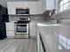 Modern kitchen featuring stainless steel appliances and white cabinets at 6677 W Longview Dr, McCordsville, IN 46055