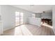 Bright living room featuring sliding glass door access to the backyard and views to the billiards room at 6677 W Longview Dr, McCordsville, IN 46055