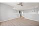 Open loft area with neutral paint, light wood floors, and chandelier lighting, perfect for entertaining at 6677 W Longview Dr, McCordsville, IN 46055