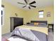 Bright, sunny bedroom in yellow with a large bed and stylish decor at 6919 Sable Point Dr, Brownsburg, IN 46112