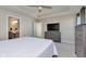 Bright main bedroom features a soft color palette, modern furniture, and ensuite bath at 6919 Sable Point Dr, Brownsburg, IN 46112