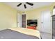 Bright bedroom features ceiling fan and convenient access to the hallway at 6919 Sable Point Dr, Brownsburg, IN 46112