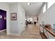 Inviting entryway with light wood floors and an open view to a cozy living room at 6919 Sable Point Dr, Brownsburg, IN 46112