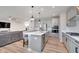 Spacious kitchen featuring a central island, stainless steel appliances, and gray cabinetry at 6919 Sable Point Dr, Brownsburg, IN 46112