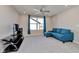 Inviting living room features a comfortable blue sectional sofa, entertainment center, and large window at 6919 Sable Point Dr, Brownsburg, IN 46112