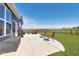 Backyard features patio with outdoor seating and large yard at 6919 Sable Point Dr, Brownsburg, IN 46112