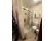 Well-maintained bathroom featuring a tiled shower with sliding glass doors, and a toilet at 70 Joseph Ln, Whiteland, IN 46184