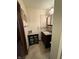 Cozy bathroom with vanity and sink, tiled floor, and updated fixtures at 70 Joseph Ln, Whiteland, IN 46184