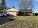 Charming brick ranch home featuring an attached two-car garage and well-manicured front lawn at 70 Joseph Ln, Whiteland, IN 46184