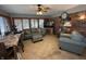 Cozy living room with lots of windows, tile floor, and a brick accent wall at 70 Joseph Ln, Whiteland, IN 46184