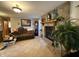 Inviting living room with a stone fireplace, wood mantle, and a comfortable couch at 70 Joseph Ln, Whiteland, IN 46184