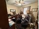 This office features a ceiling fan, neutral-toned walls, and natural light from the window at 70 Joseph Ln, Whiteland, IN 46184