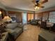 Sun room features plantation shutters, ceiling fan and dining table at 70 Joseph Ln, Whiteland, IN 46184