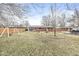 Spacious backyard featuring a playset, fenced yard, and a patio perfect for outdoor entertaining at 714 School St, Greenfield, IN 46140