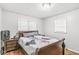 This bedroom offers natural light, hardwood floors, neutral paint, and a good sized closet at 714 School St, Greenfield, IN 46140