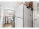 This utility room features a washer and dryer, storage above, and access to the backyard at 714 School St, Greenfield, IN 46140