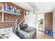 This utility room has a washer and dryer and storage above, leading to the kitchen at 714 School St, Greenfield, IN 46140