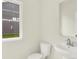 Simple powder room with a pedestal sink and toilet, offering a functional space at 7168 Jackson Dr, Cumberland, IN 46229