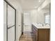 Bright bathroom features a double vanity and large glass enclosed shower at 7168 Jackson Dr, Cumberland, IN 46229