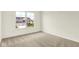 Bright bedroom with large window and a view of neighborhood at 7168 Jackson Dr, Cumberland, IN 46229