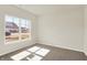 Cozy carpeted bedroom with bright natural light streaming through a large window at 7168 Jackson Dr, Cumberland, IN 46229