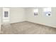 Bedroom with two windows and neutral walls at 7168 Jackson Dr, Cumberland, IN 46229