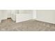 Hallway features neutral carpeting, white walls, and multiple doorways at 7168 Jackson Dr, Cumberland, IN 46229