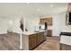 Modern kitchen with island and stainless-steel appliances, perfect for cooking and entertaining at 7168 Jackson Dr, Cumberland, IN 46229
