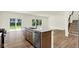 Stylish kitchen island features a sink, dishwasher, and sleek countertop at 7168 Jackson Dr, Cumberland, IN 46229