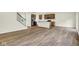 Open concept showcasing hardwood floors, stainless steel appliances and a kitchen island at 7168 Jackson Dr, Cumberland, IN 46229
