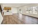 Spacious living room with wood floors, a sliding glass door, and windows with lots of natural light at 7168 Jackson Dr, Cumberland, IN 46229