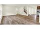 Spacious living area with hardwood floors, neutral walls and open concept living at 7168 Jackson Dr, Cumberland, IN 46229
