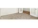 Carpeted room with french doors, neutral walls, and base trim at 7168 Jackson Dr, Cumberland, IN 46229