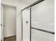 Close-up of the bright white stand-up shower with glass doors at 7168 Jackson Dr, Cumberland, IN 46229