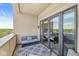 Cozy balcony featuring comfortable seating, stylish rug, and glass doors offering seamless indoor-outdoor living at 720 S Rangeline Rd # 703, Carmel, IN 46032
