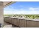 Enjoy stunning panoramic views from this private balcony, showcasing the surrounding cityscape and lush greenery at 720 S Rangeline Rd # 703, Carmel, IN 46032
