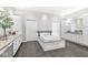 Elegant bathroom featuring a large soaking tub, granite counters, and custom cabinetry for ample storage at 720 S Rangeline Rd # 703, Carmel, IN 46032