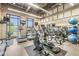 Modern gym offering treadmills, elliptical machines, stationary bikes, and weight training equipment in a spacious environment at 720 S Rangeline Rd # 703, Carmel, IN 46032