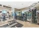 Well-equipped gym featuring modern cardio machines, free weights, and mirrored walls for a comprehensive workout experience at 720 S Rangeline Rd # 703, Carmel, IN 46032